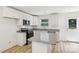 Bright kitchen features granite countertops, stainless steel appliances, and a central island at 401 W Charlotte Ave, Mount Holly, NC 28120