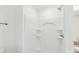 Bright, white shower stall features built-in shelves and modern fixtures at 401 W Charlotte Ave, Mount Holly, NC 28120