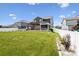Spacious backyard with a well-maintained lawn, white fence, and mature landscaping at 4029 Spring Garden St, Fort Mill, SC 29715