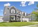 Beautiful two-story home featuring gray siding, white trim, and a well-manicured front yard at 4029 Spring Garden St, Fort Mill, SC 29715