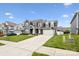 Beautiful home showcasing a well-kept lawn, concrete driveway, and classic two-story facade at 4029 Spring Garden St, Fort Mill, SC 29715