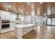 Open-concept kitchen featuring a large island, white cabinets, and stainless steel appliances at 4029 Spring Garden St, Fort Mill, SC 29715