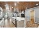 Bright, open kitchen features a large island, wood ceiling, and modern finishes at 4029 Spring Garden St, Fort Mill, SC 29715