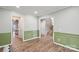 Spacious living room boasting hardwood floors, elegant trim, and open doorways at 4029 Spring Garden St, Fort Mill, SC 29715