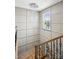 Staircase with modern chandelier and wainscotting at 4029 Spring Garden St, Fort Mill, SC 29715