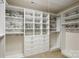 Custom walk-in closet with built-in shelving, drawers, and ample storage space at 4029 Spring Garden St, Fort Mill, SC 29715