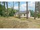 The back of this home features a freshly built wooden deck at 403 W Charlotte Ave, Mount Holly, NC 28120