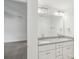 Bathroom with a double vanity, granite countertops, and carpeted floors at 403 W Charlotte Ave, Mount Holly, NC 28120