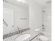 A bathroom features a granite-topped vanity and a tub-shower combo at 403 W Charlotte Ave, Mount Holly, NC 28120