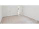 Spacious bedroom featuring neutral carpet and white walls at 403 W Charlotte Ave, Mount Holly, NC 28120