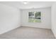 A well-lit bedroom shows off the plush carpeting at 403 W Charlotte Ave, Mount Holly, NC 28120
