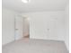Bright bedroom with neutral carpet, white walls, and ample natural light at 403 W Charlotte Ave, Mount Holly, NC 28120