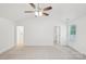 Spacious main bedroom featuring carpet, ceiling fan, and ensuite bathroom at 403 W Charlotte Ave, Mount Holly, NC 28120