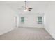 Spacious main bedroom with carpet, ceiling fan, and natural light at 403 W Charlotte Ave, Mount Holly, NC 28120