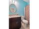 Bright bathroom with granite counters, vanity, and brown shower curtain at 4612 Saxonbury Way, Charlotte, NC 28269