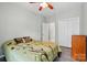 Bedroom featuring hardwood floors, a ceiling fan, and an open closet at 4612 Saxonbury Way, Charlotte, NC 28269