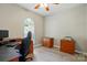 Bedroom featuring hardwood floors, a ceiling fan, a workstation, and a window at 4612 Saxonbury Way, Charlotte, NC 28269