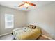 Bedroom featuring hardwood floors, a ceiling fan, and a single window at 4612 Saxonbury Way, Charlotte, NC 28269