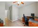Bedroom featuring hardwood floors, a ceiling fan, and a wooden desk at 4612 Saxonbury Way, Charlotte, NC 28269