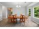 Elegant dining area with a classic wood table and ample natural light at 4612 Saxonbury Way, Charlotte, NC 28269