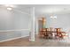 Spacious dining room featuring wood floors and a traditional chandelier at 4612 Saxonbury Way, Charlotte, NC 28269