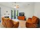 Cozy living room features a fireplace, hardwood floors, and ample natural light at 4612 Saxonbury Way, Charlotte, NC 28269