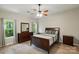 Bedroom with modern wood-look floors, ceiling fan, and matching furniture set at 4612 Saxonbury Way, Charlotte, NC 28269