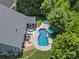 Aerial view of home with backyard pool and outdoor lounge area at 5005 Hedgebrook Ln, Waxhaw, NC 28173