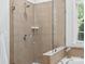 Bathroom featuring a glass enclosed shower with tiled walls and shower bench at 5005 Hedgebrook Ln, Waxhaw, NC 28173