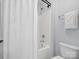 Clean, bright bathroom with white shower and toilet, featuring modern fixtures and neutral tones at 5005 Hedgebrook Ln, Waxhaw, NC 28173