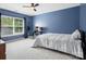 Bedroom with light walls, natural light, and carpeted floors at 5005 Hedgebrook Ln, Waxhaw, NC 28173