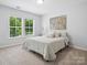Bedroom with natural light, carpeted floors and neutral walls at 5005 Hedgebrook Ln, Waxhaw, NC 28173
