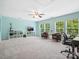 Expansive bonus room with abundant natural light, versatile seating, and a dedicated workspace at 5005 Hedgebrook Ln, Waxhaw, NC 28173