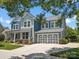 Charming two-story home with a manicured lawn, two-car garage, and a welcoming blue and gray color scheme at 5005 Hedgebrook Ln, Waxhaw, NC 28173