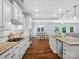 Bright, open kitchen featuring an island with granite countertops, stainless steel appliances, and a view of the breakfast area at 5005 Hedgebrook Ln, Waxhaw, NC 28173