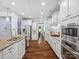 Spacious kitchen featuring custom cabinets, stainless steel appliances, and granite countertops at 5005 Hedgebrook Ln, Waxhaw, NC 28173