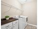 Laundry room with storage, countertop space, shelving, washer, and dryer at 5005 Hedgebrook Ln, Waxhaw, NC 28173