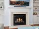 Comfortable living room featuring a fireplace with decorative mantel and built in shelving at 5005 Hedgebrook Ln, Waxhaw, NC 28173