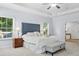 Spacious main bedroom with tray ceiling, large windows, and neutral carpet at 5005 Hedgebrook Ln, Waxhaw, NC 28173