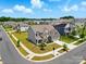 Beautiful aerial view of a landscaped neighborhood showcasing well-maintained homes and green spaces at 5114 Whispy Vines Ln, Huntersville, NC 28078