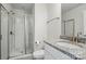 The bathroom features a granite-topped sink and glass-enclosed shower at 5114 Whispy Vines Ln, Huntersville, NC 28078
