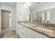The primary bathroom features double sinks, granite countertops, and a glass shower at 5114 Whispy Vines Ln, Huntersville, NC 28078