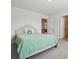 A view of a secondary bedroom with a green bedspread at 5114 Whispy Vines Ln, Huntersville, NC 28078