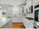 Well-lit kitchen featuring white cabinetry, subway tile backsplash, and stainless steel appliances for a modern aesthetic at 5114 Whispy Vines Ln, Huntersville, NC 28078