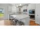 Bright kitchen with a large island, stainless steel appliances, and plenty of cabinet space for all your needs at 5114 Whispy Vines Ln, Huntersville, NC 28078