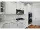 Bright kitchen featuring white cabinets, stainless steel appliances, and subway tile backsplash at 5114 Whispy Vines Ln, Huntersville, NC 28078