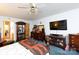Cozy bedroom with carpet, wooden furniture, large TV and decorative display cabinet at 517 Powell St, Rock Hill, SC 29732