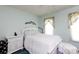 Well-lit bedroom with a white wooden bed frame and light blue walls at 517 Powell St, Rock Hill, SC 29732