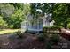 Quaint home with a welcoming front porch and well-manicured landscaping, creating a cozy curb appeal at 517 Powell St, Rock Hill, SC 29732