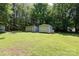 Spacious backyard with multiple outbuildings, offering versatile storage or workshop options at 517 Powell St, Rock Hill, SC 29732